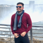 Travel Advisor Marco Suárez in front of the Niagara Falls while traveling through Canada